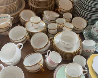 $360. Theodore Haviland Limoges china set consisting of 9 salad plates, 6 bread/butter plates, 9 compotes with saucers, 9 two handled soup cups with saucers and 7 teacups and saucers.