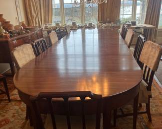$1600. Stunning antique mahogany dining table. Three separate sections. Shown here with all three sections in.  Here it is 14'3" long by 52"w x 29.5"h. Seats 16.   Center section can be a separate section becomes a 74" long table.  Available for online purchase which opens Wednesday at 7pm.  See sale description to learn how to buy online. 