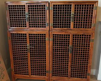$5800.  Pair of Rosewood  open hatched doors cabinets.  Each is an upper and a lower piece.  Each two tiered cabinet is 31.5"w x 18.5"d x 65"h. 