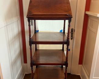 $1200. English etagere or "Whatnot" in mahogany with four shelves and one drawer below on short turned legs. The top is adjustable as a bookstand or can lay flat with the drawer at the base.  20" w x 18"d x 51.5"h.  Dating to 1840.  Originally $4000.  Available for online purchase which opens Wednesday at 7pm.  See sale description to learn how to buy online. 