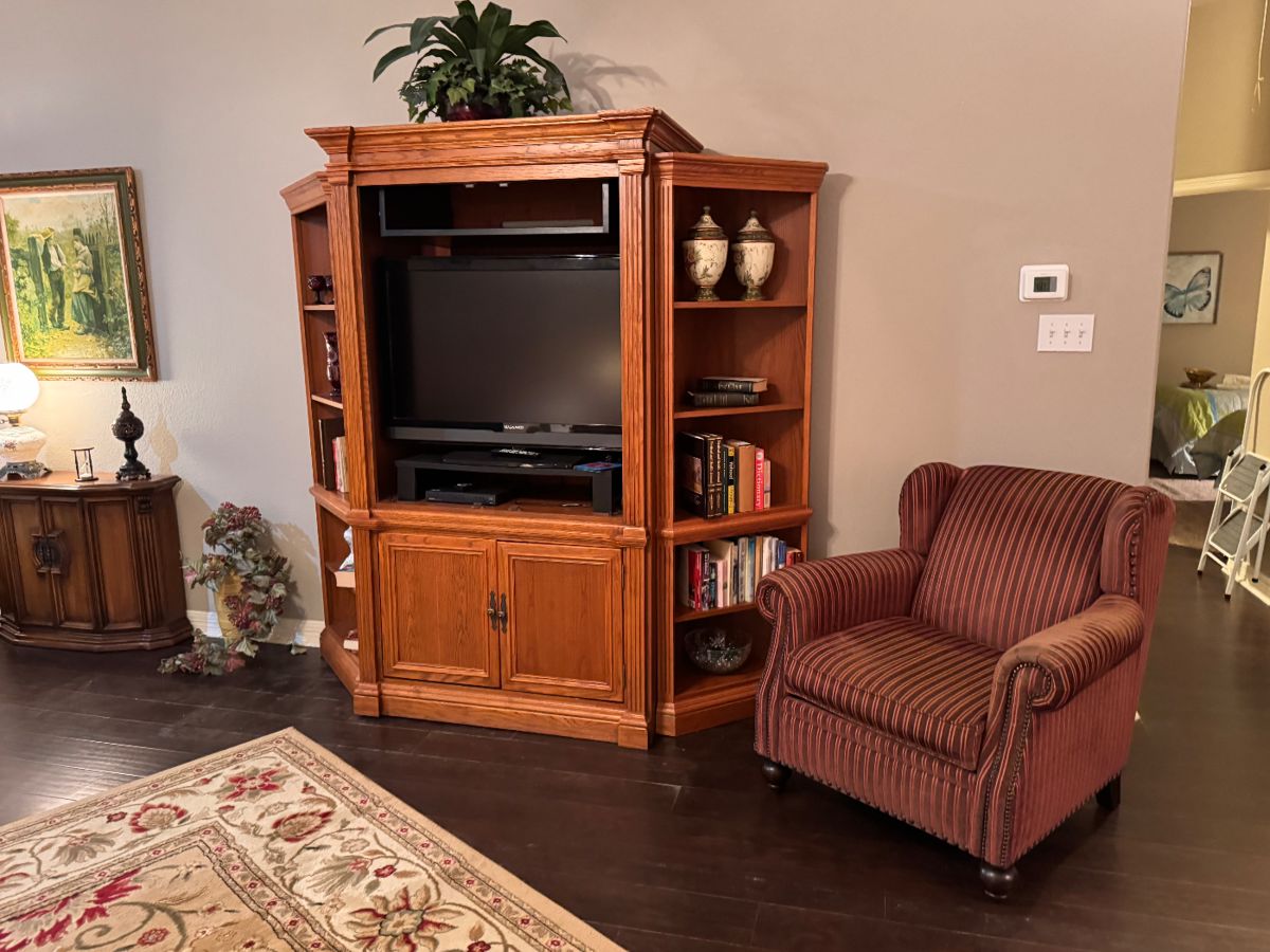 Three piece entertainment center.  A casual chair for reading. 
