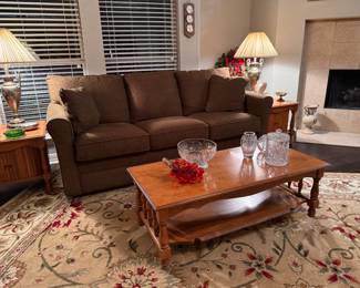 Extremely nice full-size couch.  Looks new, sofa sleeper  solid wood coffee table   Two end tables with rolling side doors 