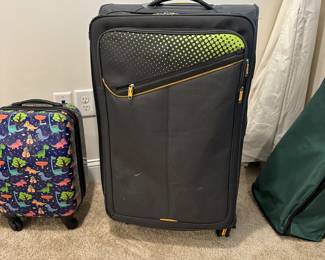 C30 - $10 Large wheeled suitcase with corner wear. 