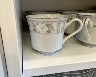 C77 - $75. Fine China Japan "Interlude". 1 Large Platter. 8 dinner plates, 8 salad bowls, 10 cups, 8 saucers, 8 small bowls, 8 dessert bowls, sugar & creamer, 1 large serving bowl. 