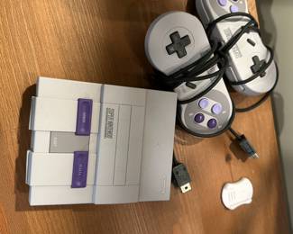 C85 - $75. Super Nintendo - 2 Controllers. No games. 
