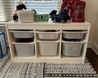 C67 - $60. IKEA. Measures 39" wide x 17" deep x 22.25" tall. With storage bins. A few marks in the wood but sturdy and lots of life left!