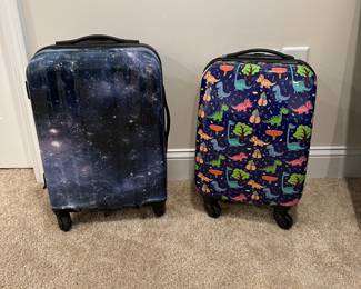 C28 - Hard Rolling Suitcases. LEFT $5 - corner is cracked. Right $10. 
