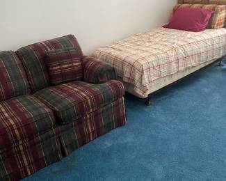 A second twin bed
Plaid sofa