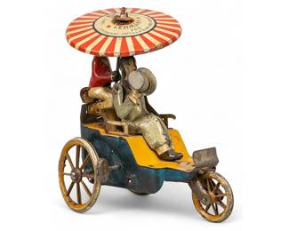 Antique Lehmann (DEU) Tinplate Toy
Lehmann (Germany) New Century Cycle wind-up lithographed tinplate toy, with polychrome paint, marked on umbrella, circa 1907