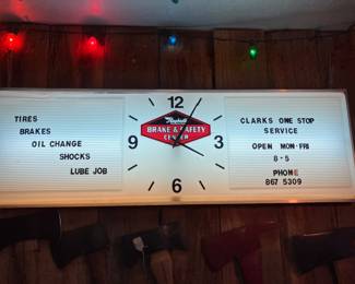 Shop advertising clock- sign.