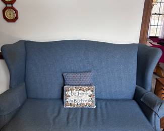 Newly Upholstered Wingback Loveseat