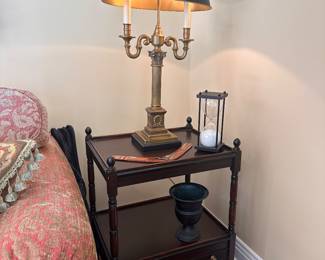 Brass lamp on two-tiered table