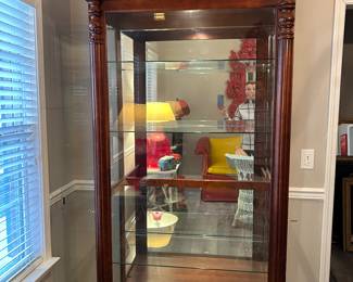 Howard Miller lighted display case. 7’ x 42” x 22”. Locking side entry on both sides