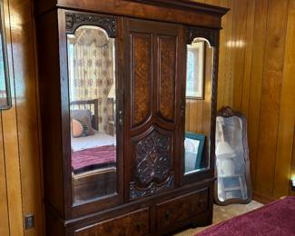 BEAUTIFUL ORNATE CARVED ARMOIRE WITH BEVELED MIRRORS