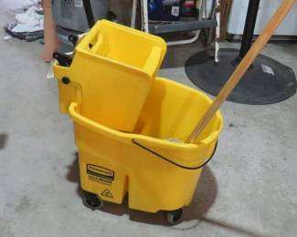 yellow commercial mop bucket with mop and wringer