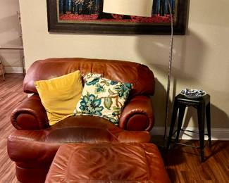 Well loved leather side chair and Ottoman (46" w x 42" d):  $200.00