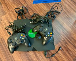 Microsoft X-Box console & 2 controls (released in 2001):  $98.00