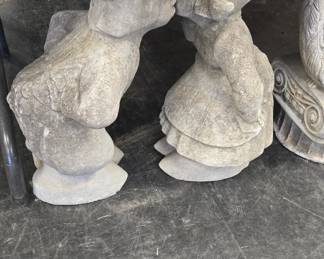 concrete statues and planters