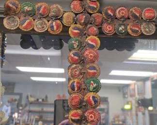 old cross made of bottle tops