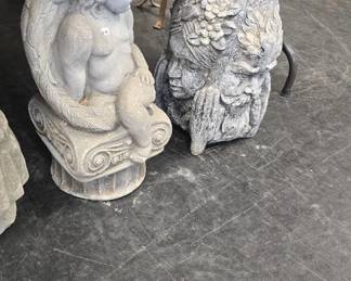 concrete statues and planters