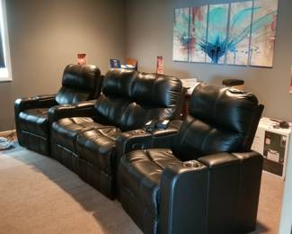 Home theater seating - four electronic recliners with beverage holders are fully adjustable. Sold as a unit of four seats