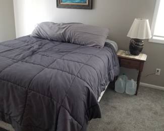 Queen bed; nightstand & table lamp