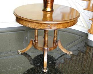 Lion claw drum table with lion head accents