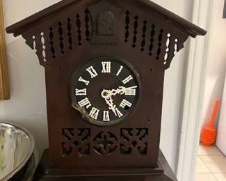 Antique cuckoo clock with key.