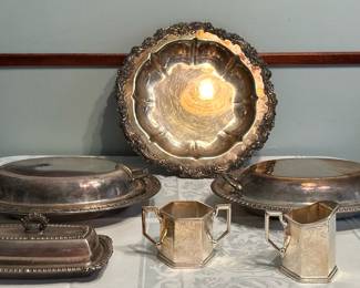 (6pc) Silver Plate Serving Pieces | Assortment of silver plate serving pieces including a creamer and sugar bowl, lidded dishes and trays.
