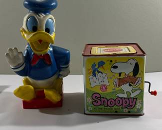 (2pc) Donald Duck & Snoopy Toys | Vintage (1960's) Disney's Donald Duck piggy bank and Mattel's Snoopy wind-up music box.
