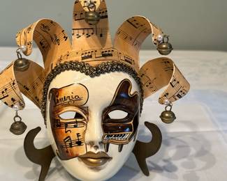 Italian Jester/Musician Mask | Venetian hand-painted ceramic masquerade mask featuring sheet music, dangling bells and a painted piano. -  h. 7 x w. 7 x d. 2.5 in
