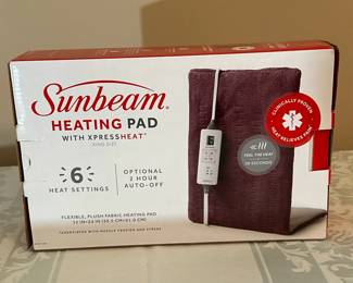 Sunbeam Heating Pad | Sunbeam king-sized heating pad with attached remote control.