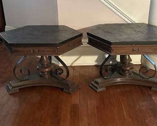 (2pc) Slate Top Low Side Tables | Pair of vintage Spanish Revival style hexagon-shaped stone top side tables with wood base and metal details. -  h. 16 x w. 22 x d. 25 in
