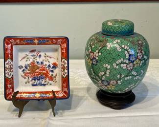 (2pc) Chinese Lidded Urn & Japanese Dish | Antique Chinese enamel lidded urn/ginger jar featuring floral patterns, atop a wooden stand, as well as a Japanese-imported square floral patterned dish from Takahashi Company in San Francisco, California. Chinese floral urn: 8 x 5.5. Japanese floral dish: 5 x 5