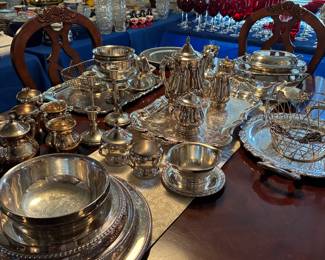 Silver trays and serving bowls and baskets