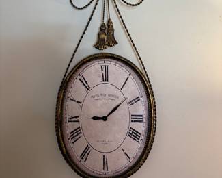Wonderful Oval Clock with metal bow and tassels