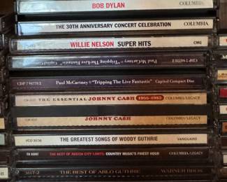 CDs by Artists Including Woodie Guthrie, Johnny Cash, Willie Nelson etc.