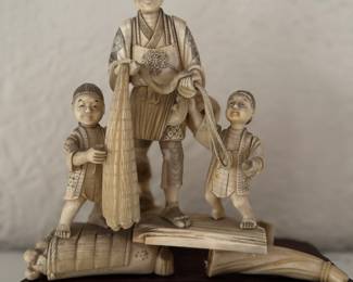 Japanese Carved Bone Sculpture of Man and 2 Sons. Photo 1 of 3.