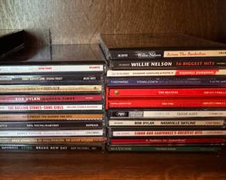 CDs by Artists Including Bob Dylan, Willie Nelson, Pink Floyd, The Beetles, Simon and Garfunkel, John Prine, The Rolling Stones, James Taylor, Neil Young an d Bruce Springsteen.