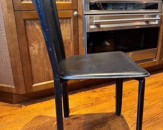 Noguchi Cyclone Dining Table & Mario Bellini Black Leather Chairs. Measures 36" D x 29" H. Photo 4 of 4.