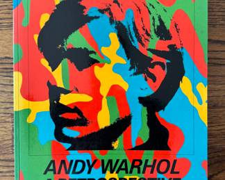 Andy Warhol - A Retrospective Soft Bound Book. Photo 1 of 2.