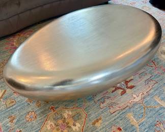 Mitchell Gold/Bob Williams 
Silver “River Stone” coffee table.
15” H,  52” L,  34” W