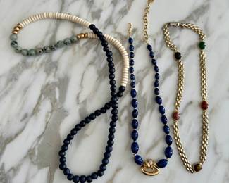 Necklaces, including Christian Dior (center) and scarab (R)