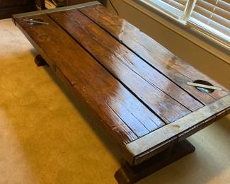 Coffee table created from a ships hatch