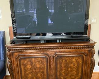 TV cabinet with Samsung TV-- TV lowers into the cabinet at the touch of a button