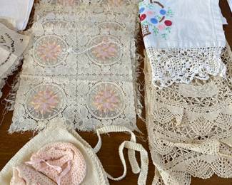 Antique lace and vintage knitted baby pieces