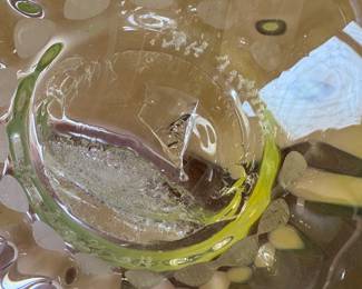 Signature on the huge yellow art glass piece.  