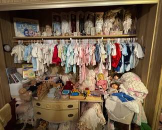 These vintage baby clothes are so cool and in great condition! Hand crocheted baby blankets, porcelain dolls, Ty Beanie Babies, Cabbage Patch Dolls with Bride and Groom outfits, and more!