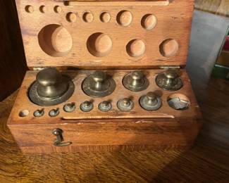 Brass scale weights with wood storage block