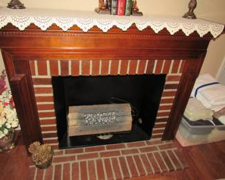 Faux fireplace- selling with the electric faux log insert shown.  Log does not produce heat.